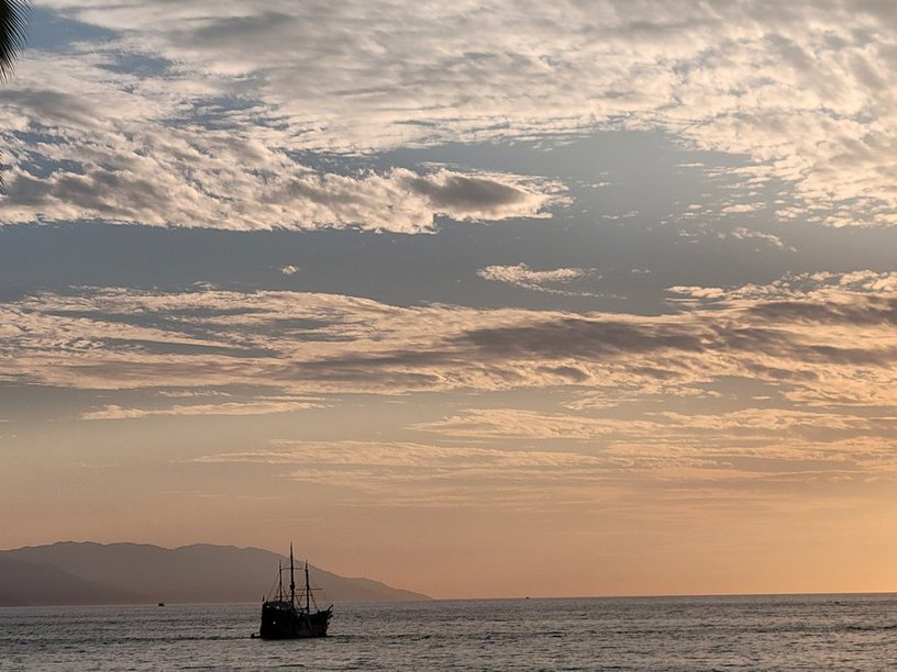 A picture of a pirate ship on the ocean